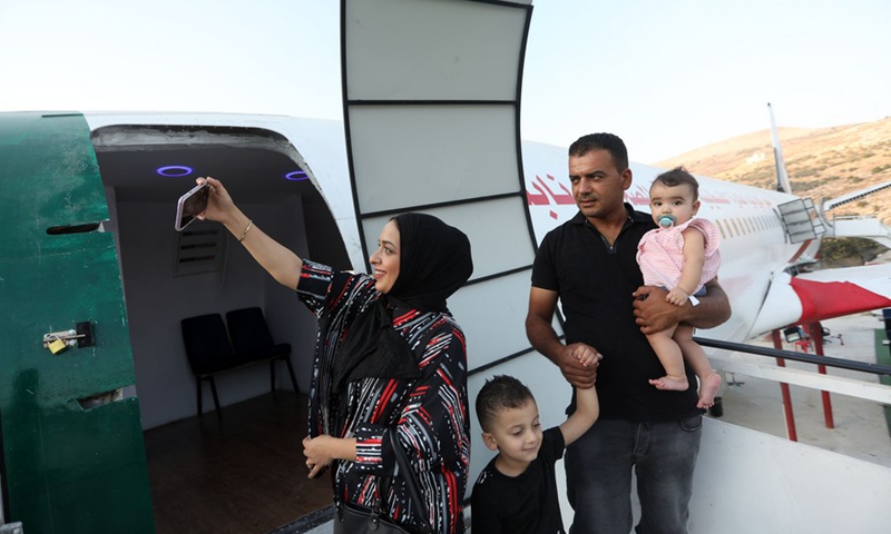 Palestinians visit the Boeing 707 aircraft which is being turned into a restaurant in the West Bank city of Nablus, July 25, 2021.(Photo: Xinhua)