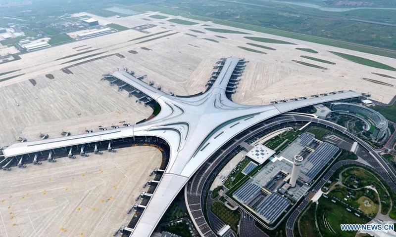 Aerial photo shows the Qingdao Jiaodong International Airport in Qingdao, east China's Shandong Province, Aug. 11, 2021. The new Qingdao Jiaodong International Airport will be put into operation on Aug. 12, while the old Qingdao Liuting International Airport will be closed. Positioned as an international hub airport in Northeast Asia, the new airport is planned to meet 35 million annual passenger throughput by 2025.(Photo: Xinhua)