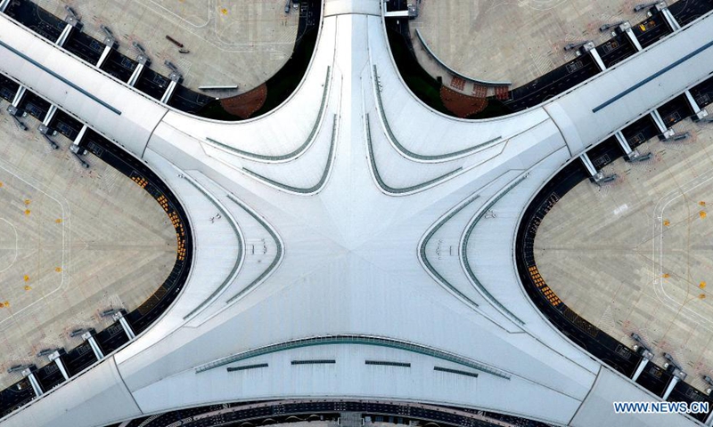 Aerial photo shows terminal of the Qingdao Jiaodong International Airport in Qingdao, east China's Shandong Province, Aug. 11, 2021. The new Qingdao Jiaodong International Airport will be put into operation on Aug. 12, while the old Qingdao Liuting International Airport will be closed. Positioned as an international hub airport in Northeast Asia, the new airport is planned to meet 35 million annual passenger throughput by 2025.(Photo: Xinhua)