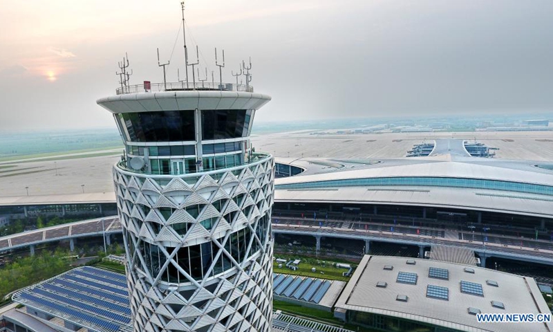Aerial photo shows the air traffic control tower of Qingdao Jiaodong International Airport in Qingdao, east China's Shandong Province, Aug. 11, 2021. The new Qingdao Jiaodong International Airport will be put into operation on Aug. 12, while the old Qingdao Liuting International Airport will be closed. Positioned as an international hub airport in Northeast Asia, the new airport is planned to meet 35 million annual passenger throughput by 2025. (Photo: Xinhua)