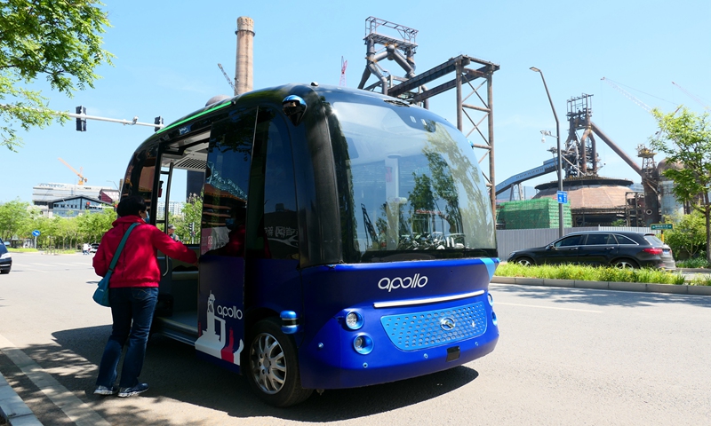 A resident gets on a Baidu Apollo minibus at the Shougang Park in Beijing on May 2, 2021. Photo: VCG