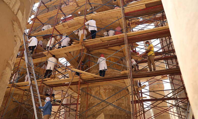 Restorers renovate the huge columns of the Great Hypostyle Hall in the Karnak Temple Complex in Luxor, Egypt, on Aug. 25, 2021.(Photo: Xinhua)
