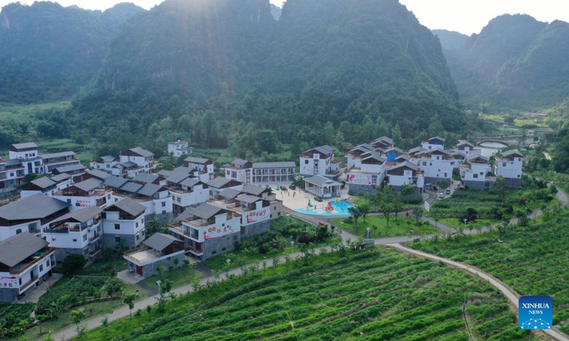Aerial photo taken on June 4, 2020 shows solar powered street lamps alongside the Bamou Village of Baise City, south China's Guangxi Zhuang Autonomous Region. More and more solar powered street lamps have been erected in areas tucked away in the mountains in Guangxi, illuminating the night sky for people living there.Photo:Xinhua