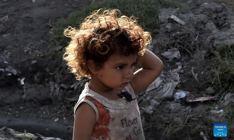 An Afghan refugee child is seen at a refugee camp in northwest Pakistan's Peshawar on Aug. 28, 2021. Pakistan currently hosts more than 1.4 million registered Afghan refugees who have been forced to flee their homes, according to the United Nations High Commissioner for Refugees (UNHCR).(Photo: Xinhua)