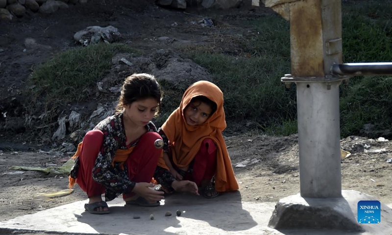 Afghan refugee girls play at a refugee camp in northwest Pakistan's Peshawar on Aug. 28, 2021. Pakistan currently hosts more than 1.4 million registered Afghan refugees who have been forced to flee their homes, according to the United Nations High Commissioner for Refugees (UNHCR).(Photo: Xinhua)