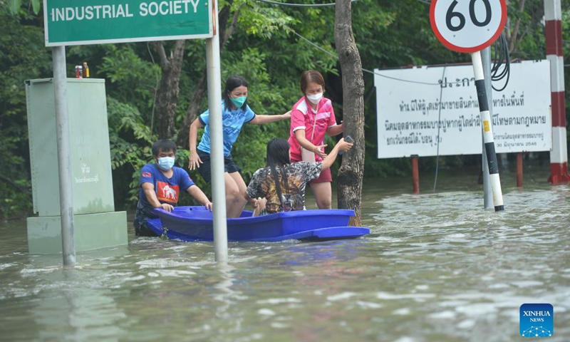 People are seen on a boat at a flooded area in Samut Prakan province, Thailand, on Aug. 29, 2021. Heavy rains caused floods in Samut Prakan province on Sunday.(Photo: Xinhua)