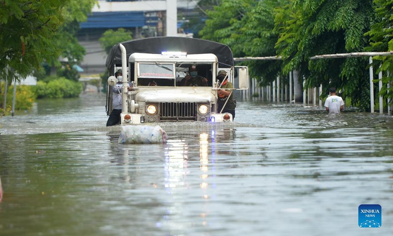 A vehicle moves through a flooded road in Samut Prakan province, Thailand, on Aug. 29, 2021. Heavy rains caused floods in Samut Prakan province on Sunday.(Photo: Xinhua)