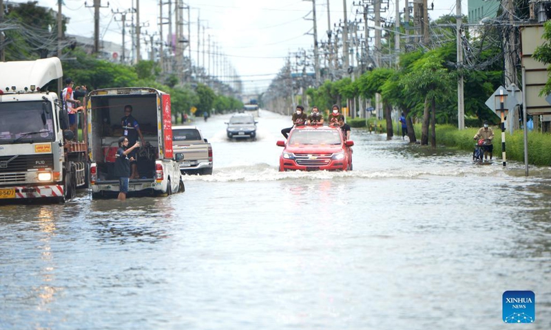 Vehicles move through a flooded road in Samut Prakan province, Thailand, on Aug. 29, 2021. Heavy rains caused floods in Samut Prakan province on Sunday.(Photo: Xinhua)