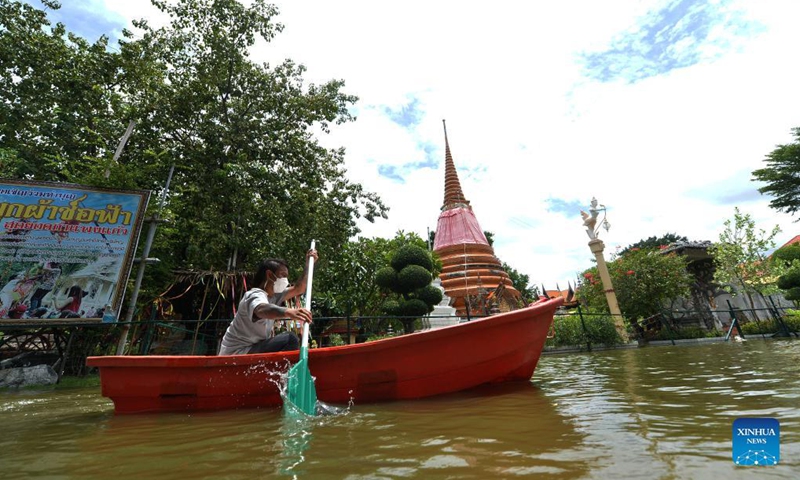 A man rows a boat through a flooded road on the outskirts of Bangkok, Thailand, on Sept. 3, 2021.Photo:Xinhua