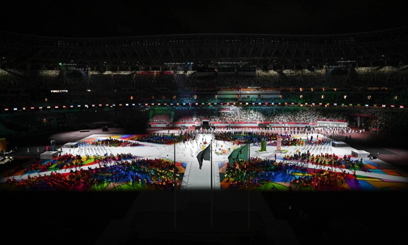 Flagbearers enter the Olympic Stadium during the closing ceremony of the Tokyo 2020 Paralympic Games in Tokyo, Japan, Sept. 5, 2021.(Photo: Xinhua)