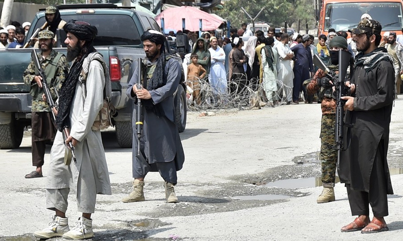 Afghan Taliban members patrol on the Afghan side near the border crossing point of Torkham between Pakistan and Afghanistan on Sept. 5, 2021. (Photo: Xinhua)