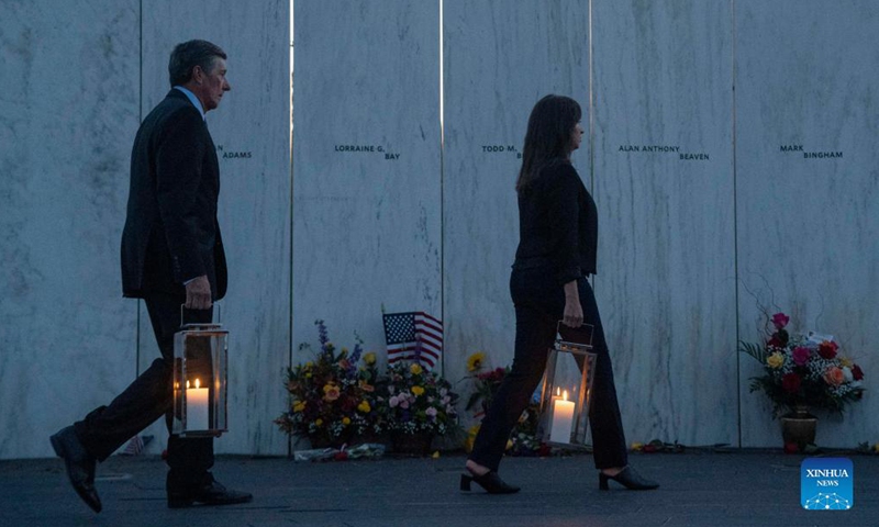 People visit the Wall of Names during a candlelight memorial to the passengers and crew of United Airlines Flight 93 in Shanksville, Pennsylvania, the United States, Sept. 10, 2021. Memorials were held at the Flight 93 National Memorial in Pennsylvania to mark the 20th anniversary of the Sept. 11 attacks.Photo:Xinhua