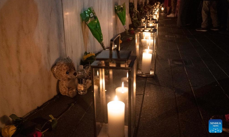People visit the Wall of Names during a candlelight memorial to the passengers and crew of United Airlines Flight 93 in Shanksville, Pennsylvania, the United States, Sept. 10, 2021. Memorials were held at the Flight 93 National Memorial in Pennsylvania to mark the 20th anniversary of the Sept. 11 attacks.Photo:Xinhua