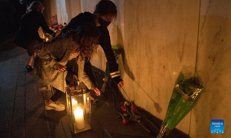 People visit the Wall of Names during a candlelight memorial to the passengers and crew of United Airlines Flight 93 in Shanksville, Pennsylvania, the United States, Sept. 10, 2021. Memorials were held at the Flight 93 National Memorial in Pennsylvania to mark the 20th anniversary of the Sept. 11 attacks.Photo:Xinhua