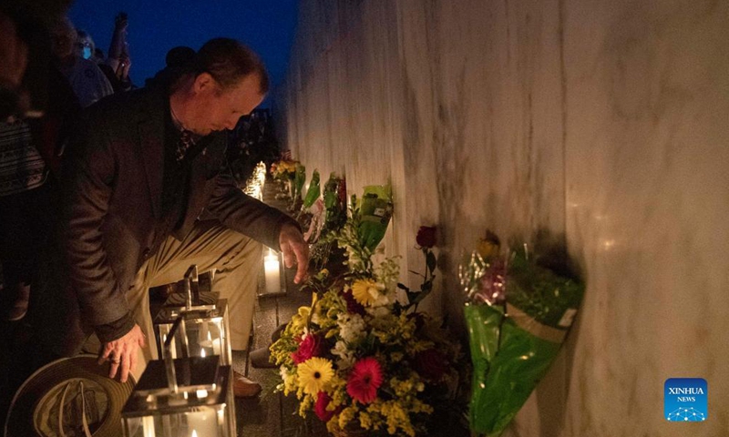 People visit the Wall of Names during a candlelight memorial to the passengers and crew of United Airlines Flight 93 in Shanksville, Pennsylvania, the United States, Sept. 10, 2021. Memorials were held at the Flight 93 National Memorial in Pennsylvania to mark the 20th anniversary of the Sept. 11 attacks.Photo:Xinhua