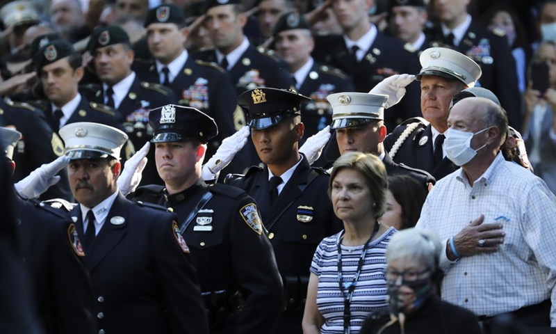 A guard of honor salutes during a commemoration ceremony of the 20th anniversary of the 9/11 attacks in New York, the United States, on Sept. 11, 2021.(Photo: Xinhua)