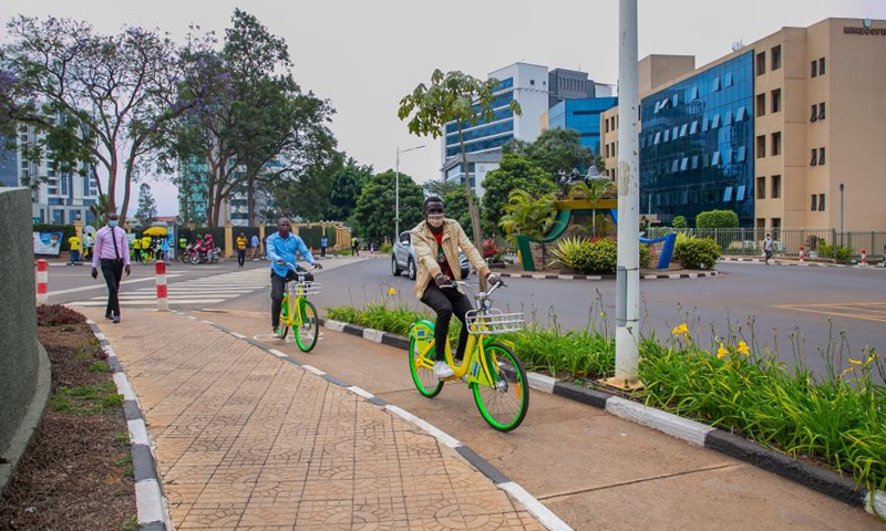 People ride shared bicycles in central business district in Kigali, Rwanda, on Sept. 9, 2021.(Photo: Xinhua)
