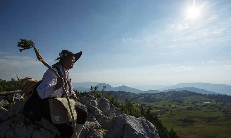 Shepherd Peter Erjavsek dressed in traditional clothes is pictured in Velika planina, Kamnik, Slovenia, Sept. 8, 2021.(Photo: Xinhua)