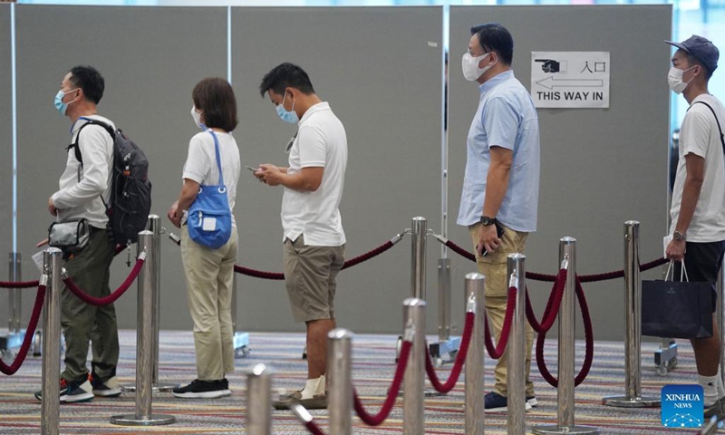 People queue to cast their ballots at a polling station at Hong Kong Convention and Exhibition Center in Hong Kong, south China, Sept. 19, 2021. The 2021 Election Committee's subsector ordinary elections in China's Hong Kong Special Administrative Region (HKSAR) started on Sunday morning, the first election after the improvements to Hong Kong's electoral system earlier this year. Photo: Xinhua