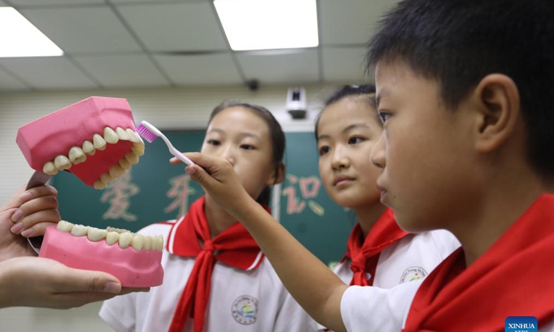 Students learn the right way to brush teeth at a school in Lincheng County of Xingtai City, north China's Hebei Province, Sept. 18, 2021. China's Dental Care Day falls on Sept. 20.Photo: Xinhua