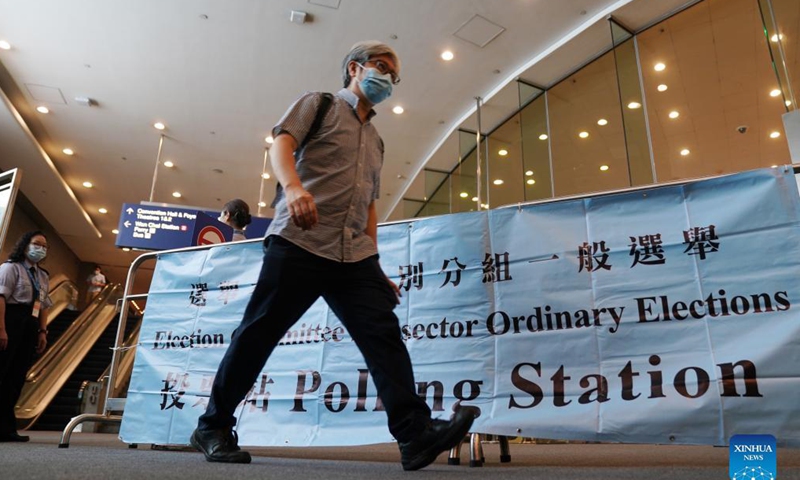 A citizen leaves after casting his ballot at a polling station at Hong Kong Convention and Exhibition Center in Hong Kong, south China, Sept. 19, 2021. The 2021 Election Committee's subsector ordinary elections in China's Hong Kong Special Administrative Region (HKSAR) started on Sunday morning, the first election after the improvements to Hong Kong's electoral system earlier this year.Photo: Xinhua