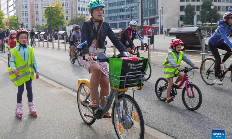 People ride bikes on Car Free Sunday in Brussels, Belgium, Sept. 19, 2021. The Car Free Sunday is valid for the public, except taxis, journey buses, emergency services, police and persons with a special permit. The whole Brussels Region is closed for traffic from 9:30 a.m. till 7 pm.  Photo: Xinhua