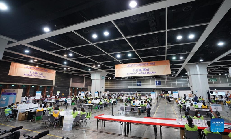 Staff members work at a counting station in Hong Kong, south China, Sept. 19, 2021. The voting of the 2021 Election Committee's subsector ordinary elections in China's Hong Kong Special Administrative Region (HKSAR) ran from 9:00 a.m. to 6:00 p.m. local time on Sunday.   (Xinhua)