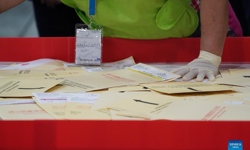 Staff members work at a counting station in Hong Kong, south China, Sept. 19, 2021. The voting of the 2021 Election Committee's subsector ordinary elections in China's Hong Kong Special Administrative Region (HKSAR) ran from 9:00 a.m. to 6:00 p.m. local time on Sunday.  (Xinhua)