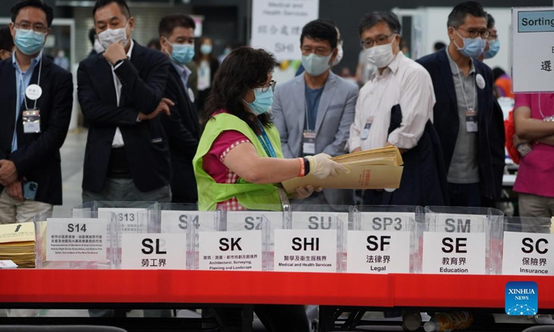 Staff members work at a counting station in Hong Kong, south China, Sept. 19, 2021. The voting of the 2021 Election Committee's subsector ordinary elections in China's Hong Kong Special Administrative Region (HKSAR) ran from 9:00 a.m. to 6:00 p.m. local time on Sunday. (Xinhua)