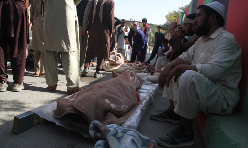 Photo taken on Sept. 29, 2019 shows people gathering around bodies of civilians who were killed in an airstrike by U.S.-led forces in Ghazni province, Afghanistan.(Photo: Xinhua)