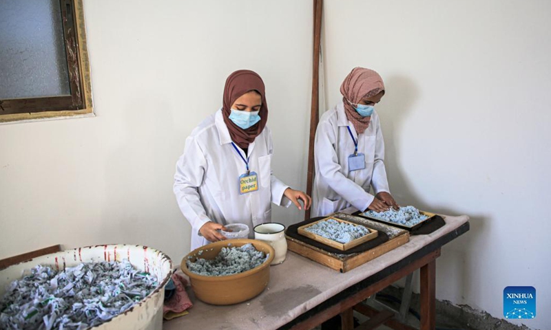 Volunteers process paper waste in al-Nuseirat refugee camp in the central Gaza Strip, on Sept. 16, 2021.(Photo: Xinhua)