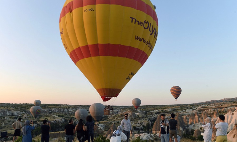 Hot air balloons are seen flying high in the sky over the famous tourist destination of Cappadocia, Turkey, on Sept. 20, 2021.(Photo: Xinhua)