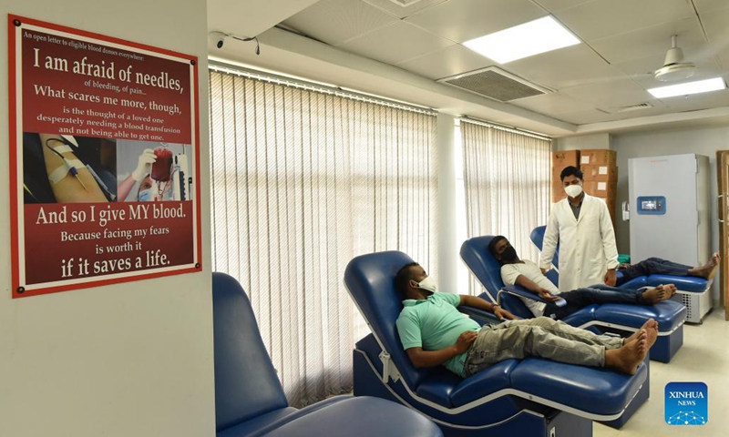 Blood donors wait at a blood bank in a hospital in Dhaka, Bangladesh, Sept. 16, 2021. Bangladesh saw a significant spike in dengue fever cases over recent months, with 15,976 cases and 59 deaths from the mosquito-borne tropical disease registered so far this year, according to the country's Directorate General of Health Services (DGHS) on Monday. Against the backdrops, Dhaka's blood banks are facing a huge rush of blood use by dengue patients with critically low platelet counts. (Photo: Xinhua)