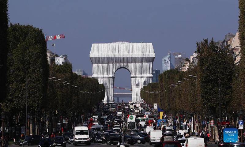 The wrapped Arc de Triomphe is seen in Paris, France, Sept. 21, 2021. The entire Arc de Triomphe at the top of the Champs-Elysees in Paris is to stay wrapped in fabric for two weeks, an art installation conceived by the late artist Christo and inaugurated on Thursday by French President Emmanuel Macron.(Photo: Xinhua)