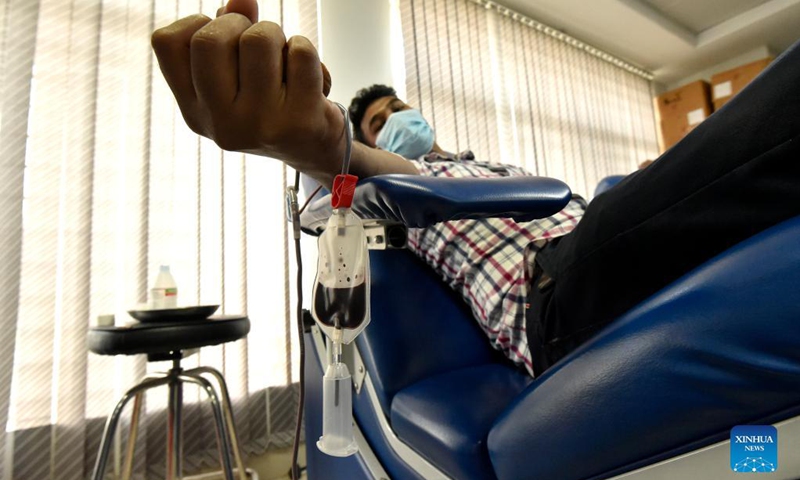A man donates blood at a blood bank in a hospital in Dhaka, Bangladesh, Sept. 16, 2021. Bangladesh saw a significant spike in dengue fever cases over recent months, with 15,976 cases and 59 deaths from the mosquito-borne tropical disease registered so far this year, according to the country's Directorate General of Health Services (DGHS) on Monday. (Photo: Xinhua)