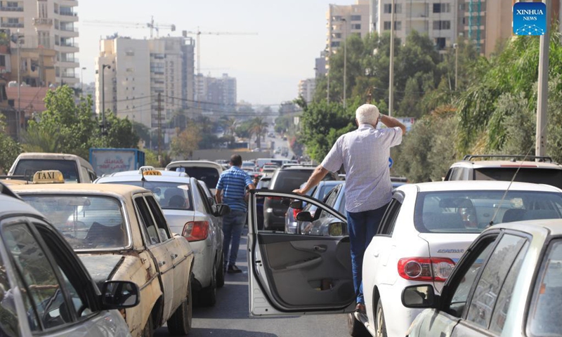 Car drivers wait for fuel on a main road near a gas station in Beirut, Lebanon, on Sept. 21, 2021. Lebanon's Energy Ministry has raised gasoline prices for the second time in less than a week, effectively ending its fuel subsidy.(Photo: Xinhua)