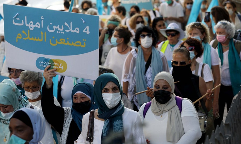 Jewish and Arab women rally for a Palestine-Israel peace deal in downtown Jerusalem on Sept. 22, 2021.(Photo: Xinhua)