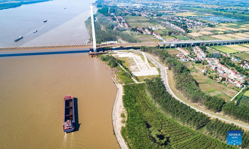 Aerial photo taken on Sept. 25, 2021 shows the Chibi Yangtze River road bridge in central China's Hubei Province. Two new bridges over the Yangtze River opened to traffic Saturday in central China's Hubei Province. With a total length of 31 km and an 808-meter-long main span, the Wuxue Yangtze River road bridge links Wuxue City with Yangxin County of Huangshi City. The bridge has six lanes with a designed speed of 100 kph.(Photo: Xinhua)
