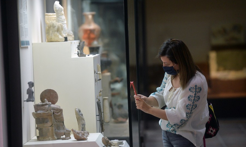 A woman wearing a face mask visits the Gordion Museum in Ankara, Turkey, on Sept. 22, 2021. The museum displays pottery, tools and other Bronze Age objects from archaeological excavations in the area.(Photo: Xinhua)