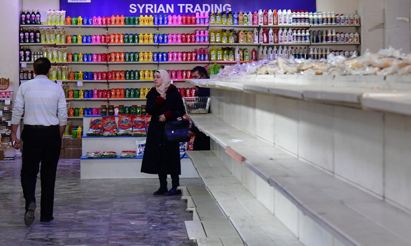 People shop at a grocery store in Damascus, Syria, on March 17, 2021. Syrian pound took a free fall and has been largely depreciating against the U.S. dollar since the beginning of this year.(Photo: Xinhua)