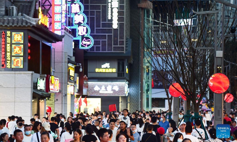 Citizens walk on the Huaihe Road in Hefei, east China's Anhui Province, Oct. 1, 2021.Photo:Xinhua