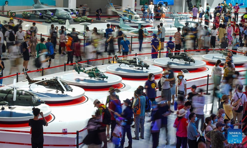 Visitors view exhibits during the 13th China International Aviation and Aerospace Exhibition, or Airshow China 2021, in Zhuhai, south China's Guangdong Province, Oct. 1, 2021.Photo:Xinhua