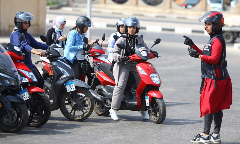 Women of different ages ride their motorcycles and scooters for some 30 km on the Cairo-Suez highway on Oct. 1, 2021. (Photo: Xinhua)