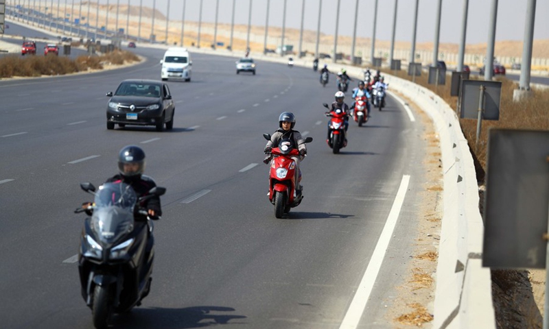 Dozens of Egyptian biker women dotted a highway in the capital Cairo to encourage more women to take the plunge and get on two wheels. (Photo: Xinhua)