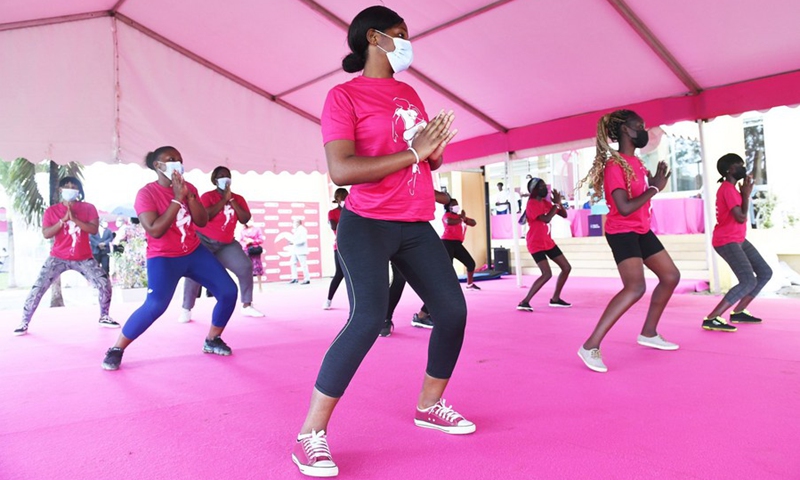 Girls take part in activities of the Pink Village in Libreville to celebrate the 8th edition of Pink October campaign in Gabon, on Oct. 1, 2021.(Photo: Xinhua)
