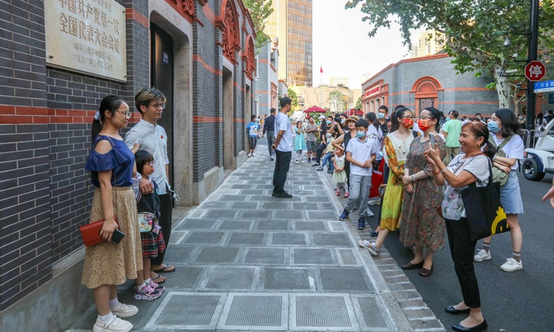 Tourists take photos at the site of the first National Congress of the Communist Party of China (CPC) in east China's Shanghai, Oct. 3, 2021.(Photo: Xinhua)