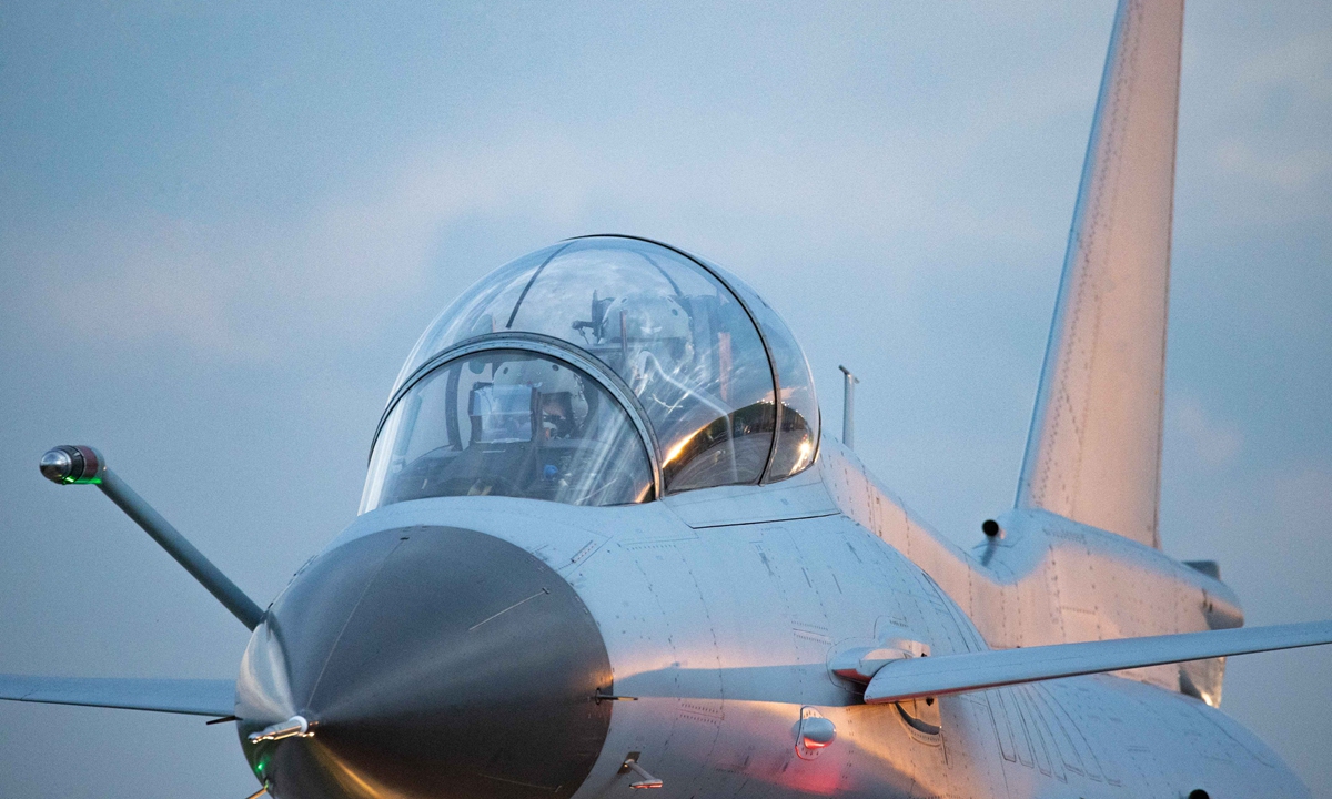 Pilots assigned to an aviation brigade of the air force under the PLA Southern Theater Command sit in the cockpit to get ready for a round-the-clock training exercise on Sept. 8, 2021. (eng.chinamil.com.cn/Photo by Wang Guoyun)

