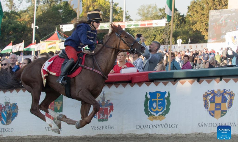 Nikolett Szabo of Hungary competes during the final of the National Gallop equestrian festival in Budapest, Hungary, on Oct. 3, 2021. (Photo by Attila Volgyi/Xinhua)
