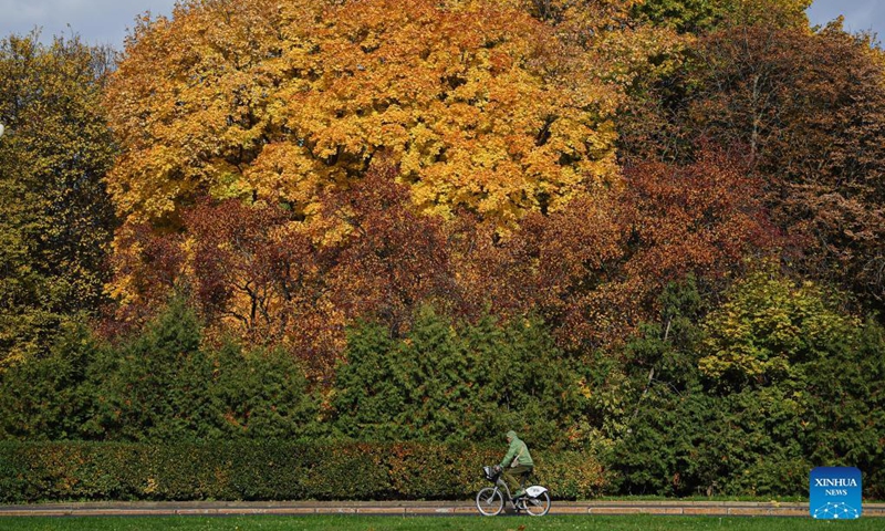 A man rides his bike near Moscow State University in Moscow, Russia, on Oct. 4, 2021. (Xinhua/Evgeny Sinitsyn)