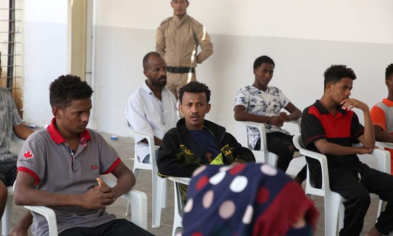 Migrants are seen waiting in the vaccine reception center in Tripoli, Libya, Oct. 6, 2021.(Photo: Xinhua)